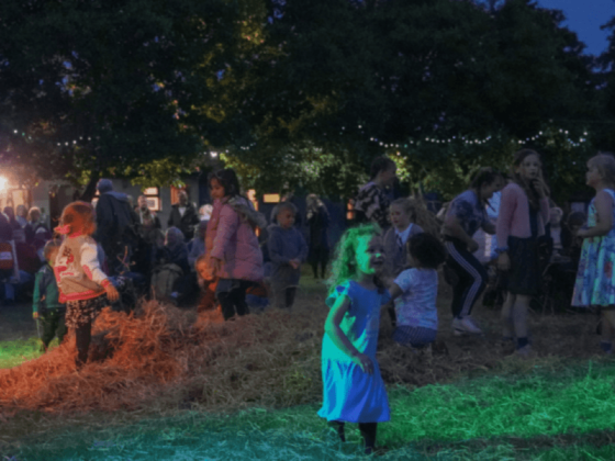 Children dancing in the evening at Party in the Park
