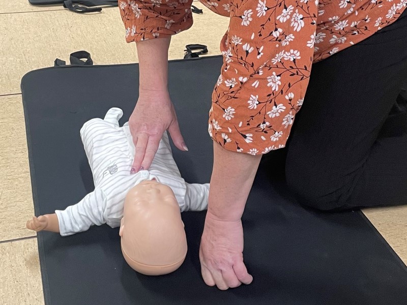 First Aid CPR training on a baby doll
