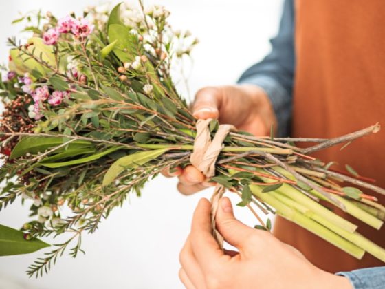 Hand tying flowers