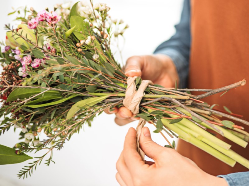 Hand tying flowers
