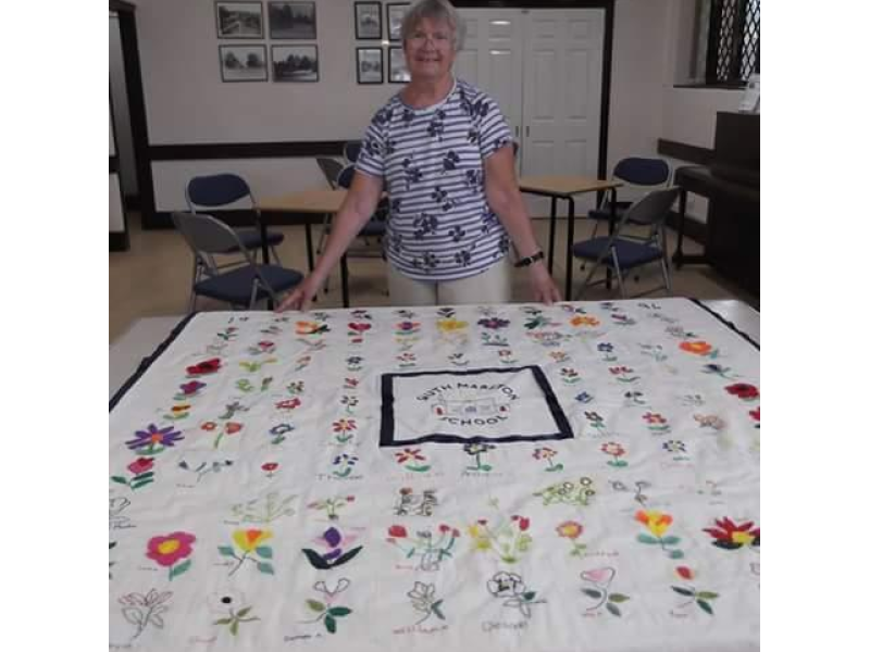Former headteacher Mrs Llewellyn return visit to the village in 2018 with her retirement gift from the schoolchildren