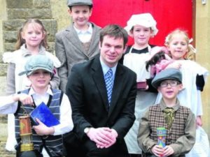 Former headteacher Luke Maddison with school children dressed in Victorian outfits