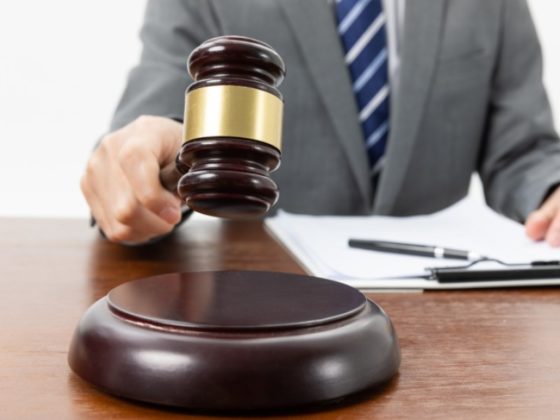 Man holding an auction gavel
