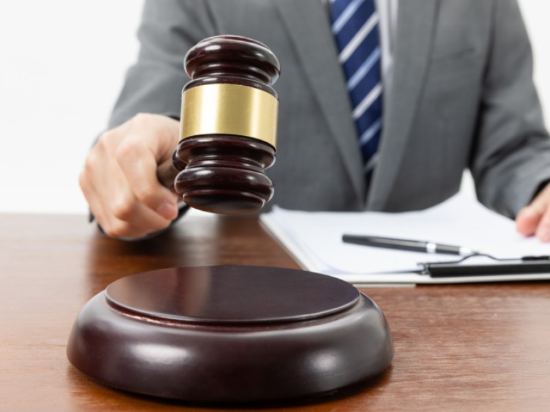 Man holding an auction gavel