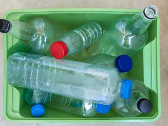 Tub of plastic bottles in varying sizes