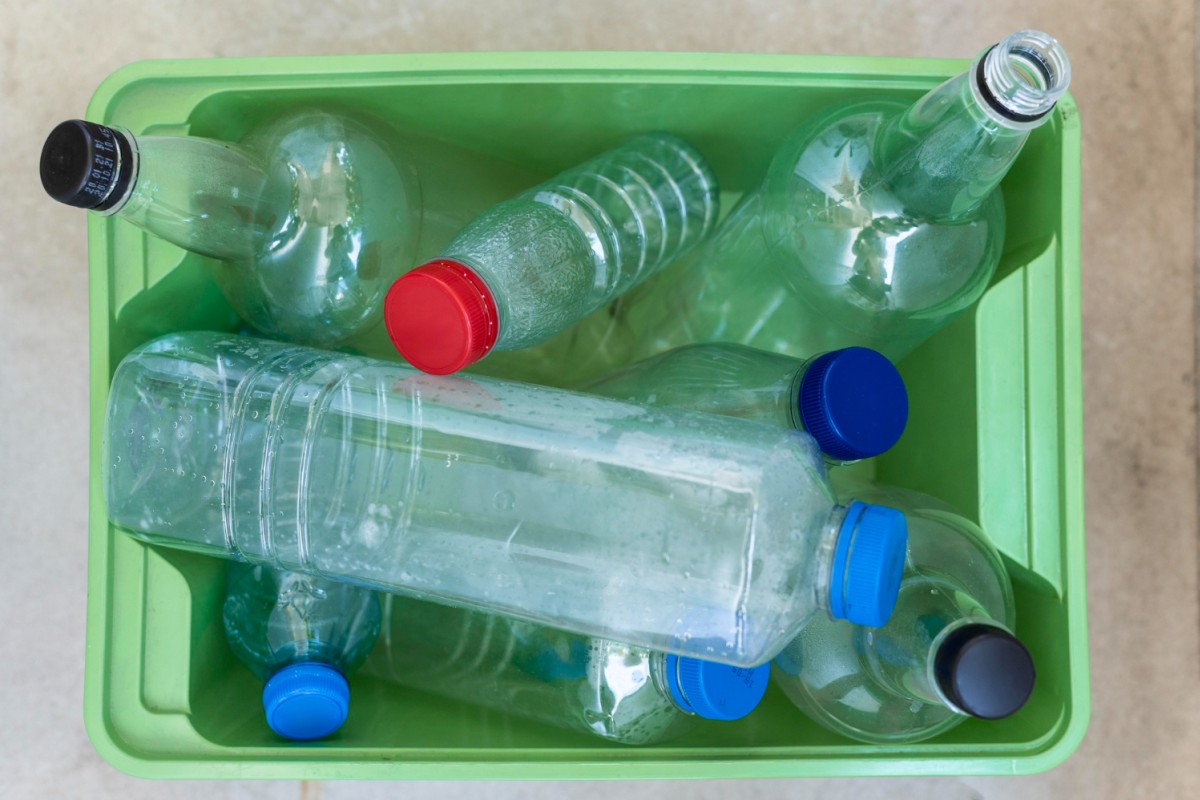Tub of plastic bottles in varying sizes